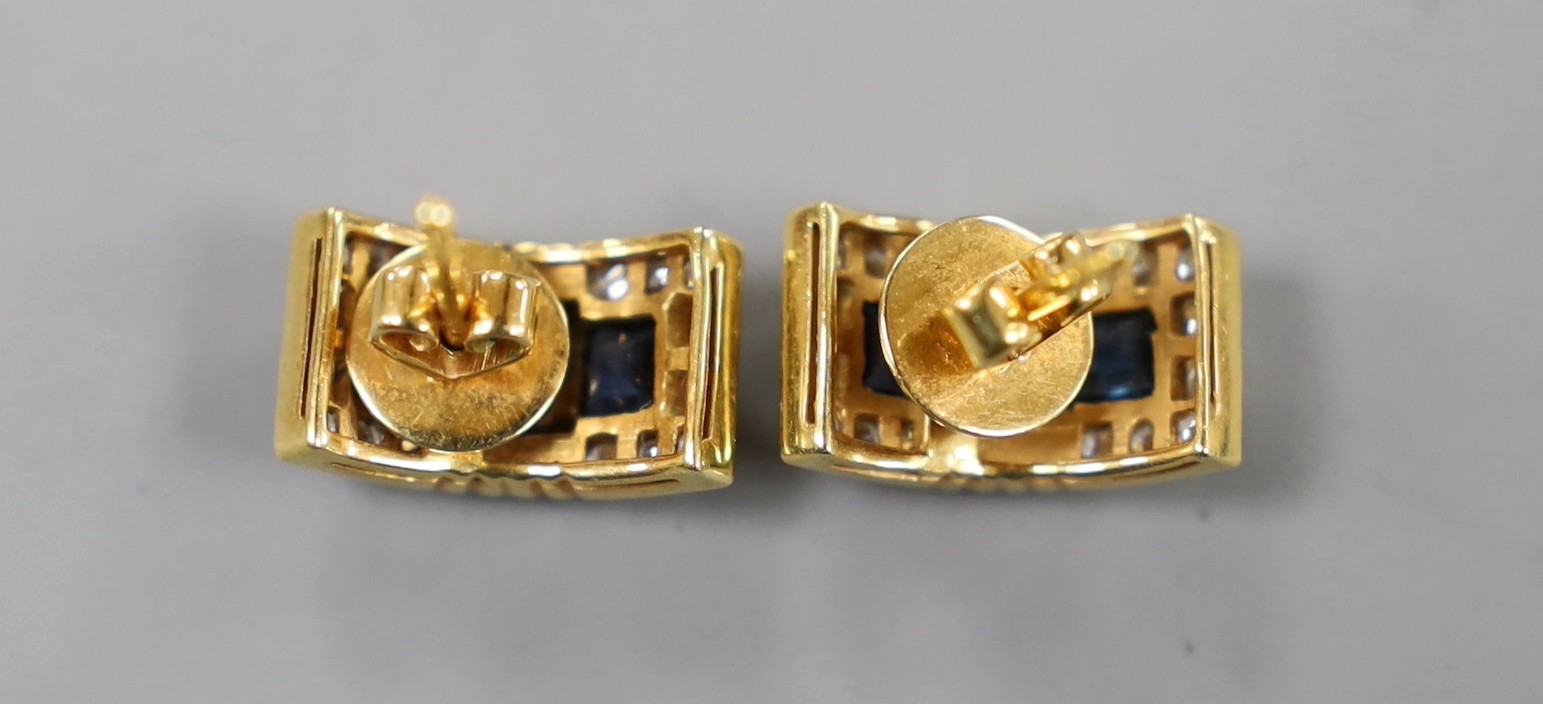A modern pair of yellow metal, sapphire and diamond cluster set curved rectangular earrings, 14mm, gross weight 5.2 grams.
